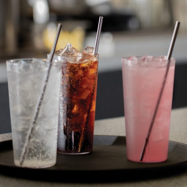 9" Straight Stainless Steel Straws in various drinks on a serving tray at a restaurant